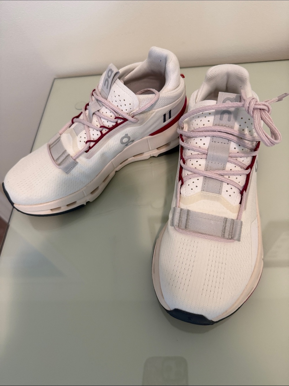 On Running Women's White Athletic Sneakers with Pink and Red Accents